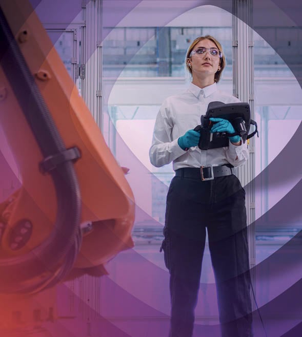 Woman standing by technology with controller in hand 